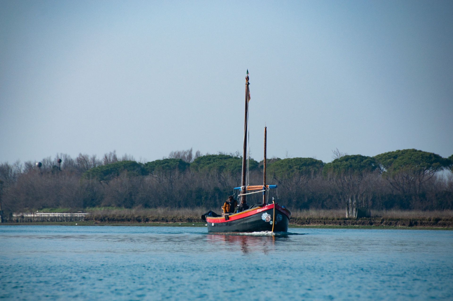 Rower in the Venice lagoon at morning